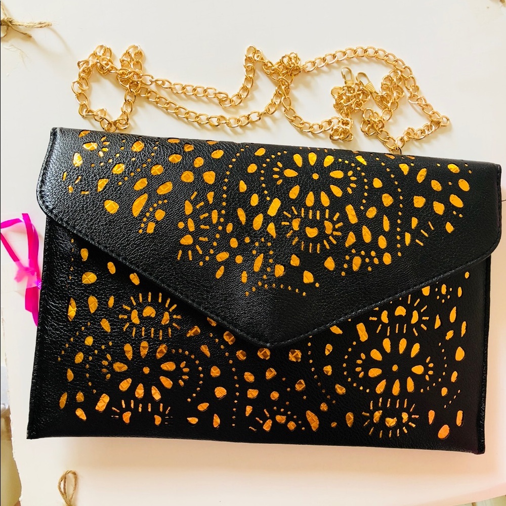 Leather envelope purse with metal strap